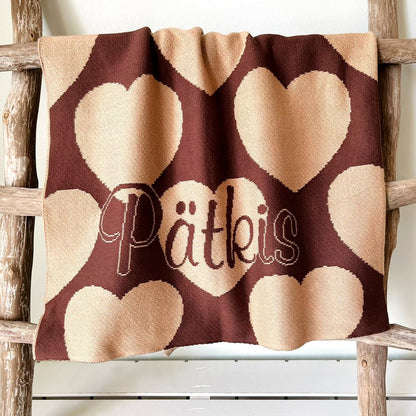 Personalized knitted blanket with hearts