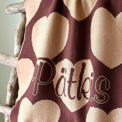 Personalized knitted blanket with hearts