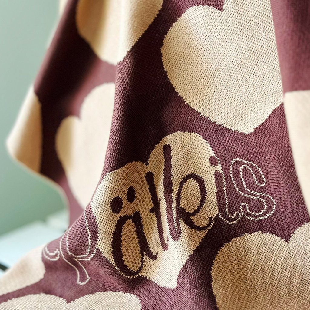 Personalized knitted blanket with hearts