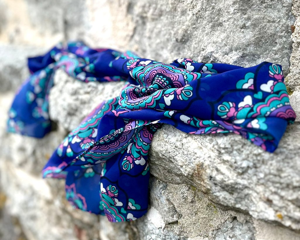 a colorful scarf with design FOREVERMORE purple. Material: rPet Chiffon.