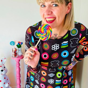 Woman in a colorful midi dress by SHALMIAK. Design: SWEET CANDY.